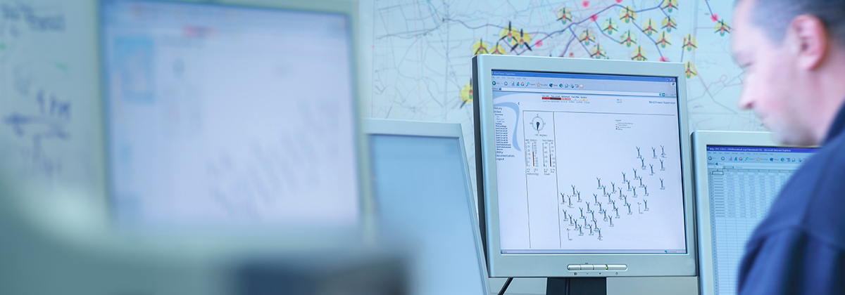 Engineer monitoring wind farm using fiber sensing